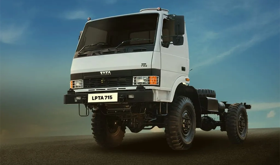 White Tata LPTA 715 4x4 off-road chassis cab truck parked on open terrain
