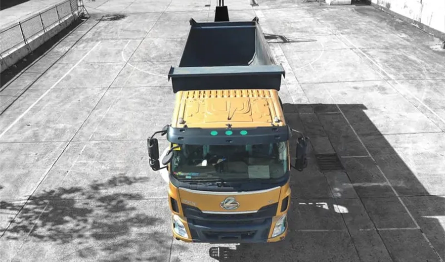 Chenglong heavy-duty tipper dump truck viewed from above with large open cargo body for construction material transport
