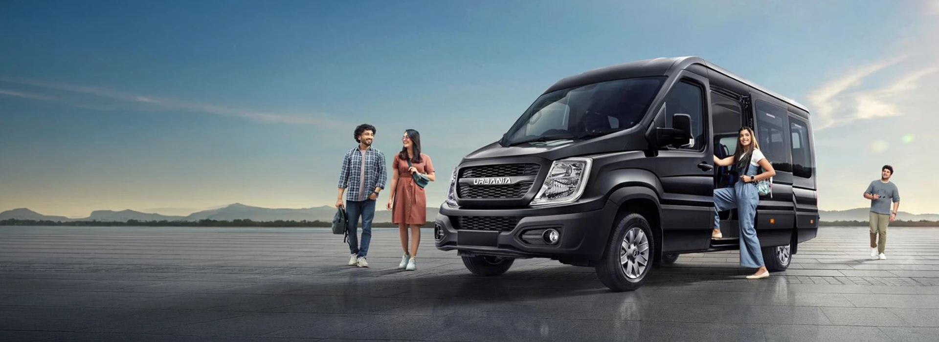 Black Force Motors Urbania passenger van parked outdoors with passengers boarding through the sliding door