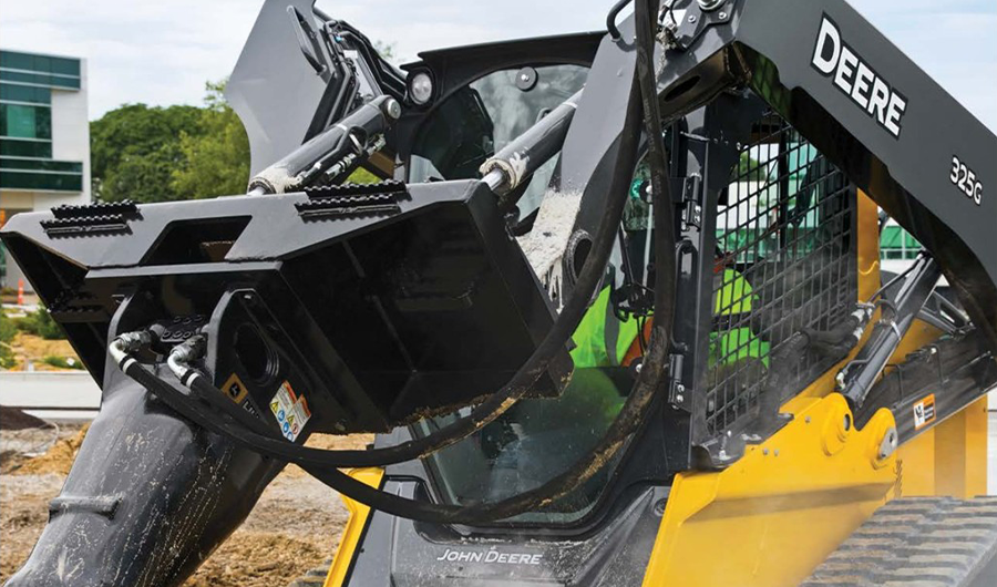 John Deere compact track loader fitted with hydraulic construction attachment