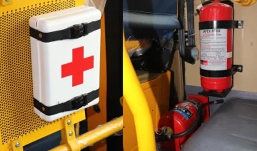School bus safety equipment including first aid kit and mounted fire extinguishers