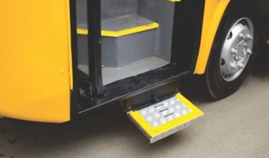 Force Monobus school bus entrance with passenger steps and extended exterior access step