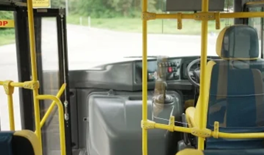 Force Monobus school bus driver area with safety barrier, handrails, dashboard and driver seat
