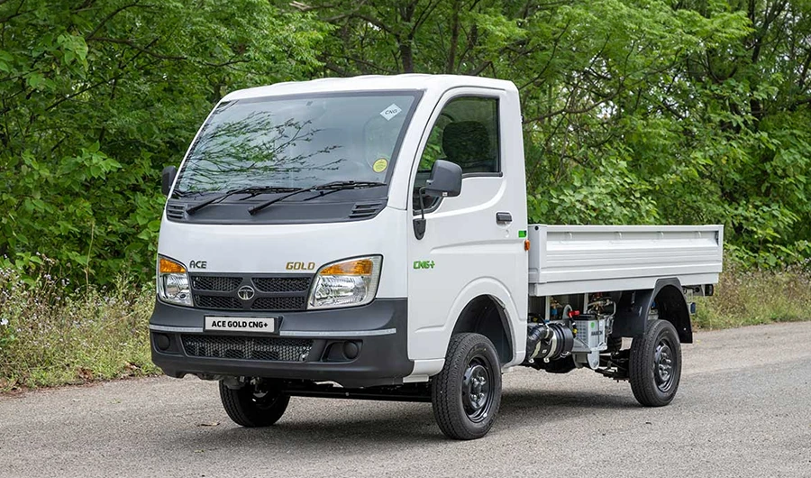 White Tata Ace Gold CNG+ mini commercial truck with open drop-side cargo bed parked on a paved road