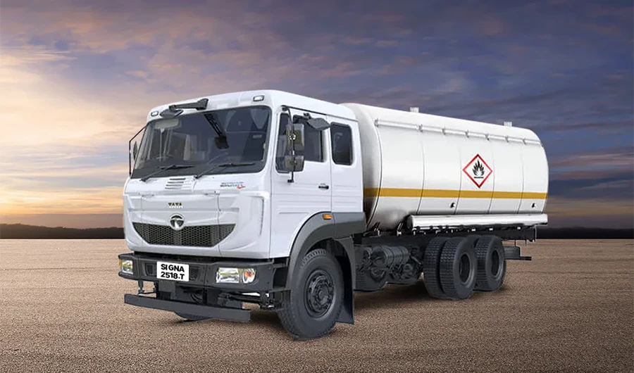 White Tata Signa 2518.T tanker truck parked against a sunset sky background.