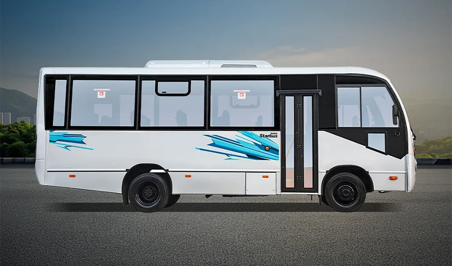 Side profile view of white Tata LP 613 Starbus passenger bus with blue decals