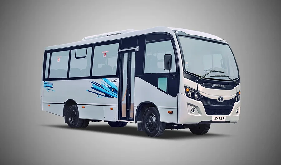 White Tata LP 613 Marcopolo Starbus passenger bus with blue body decals on a neutral background