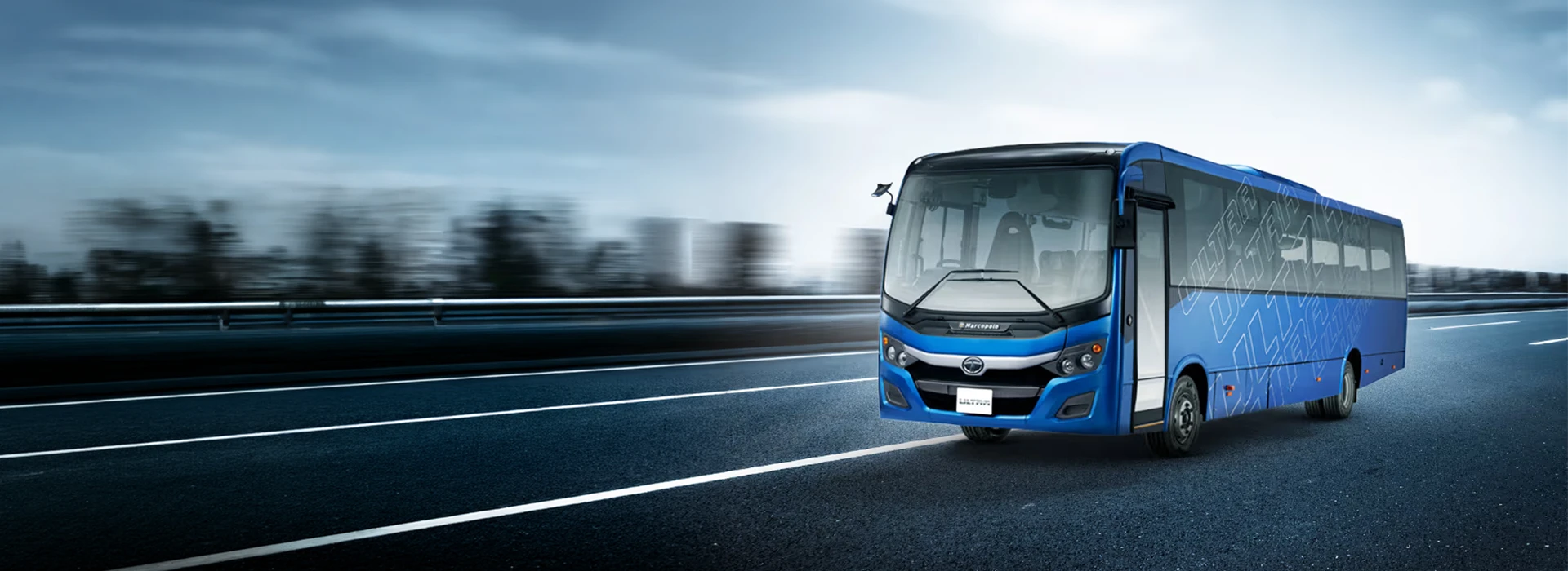 Blue Tata Starbus Ultra LPO 7.5/44 passenger bus driving on an open road