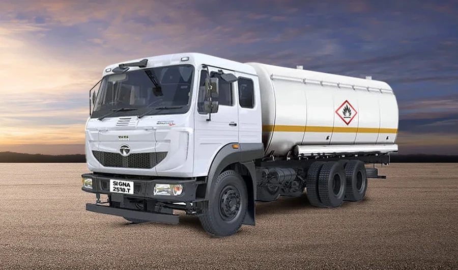 White Tata Signa 2518.T tanker truck parked against a sunset sky background.