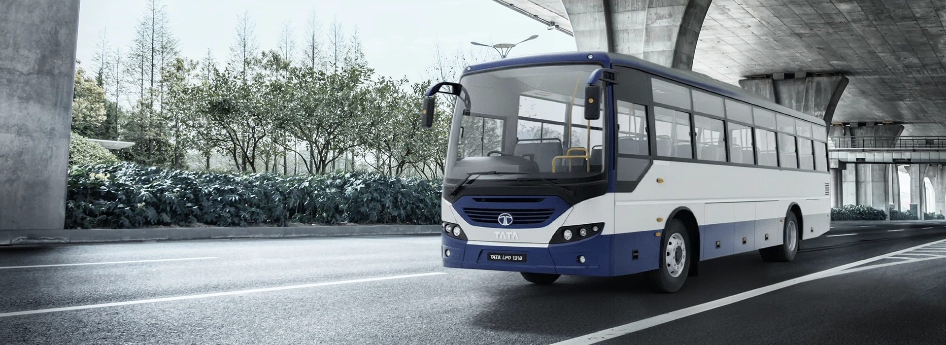 Tata LPO 1318 commercial commuter bus exterior showcase under a modern highway overpass.