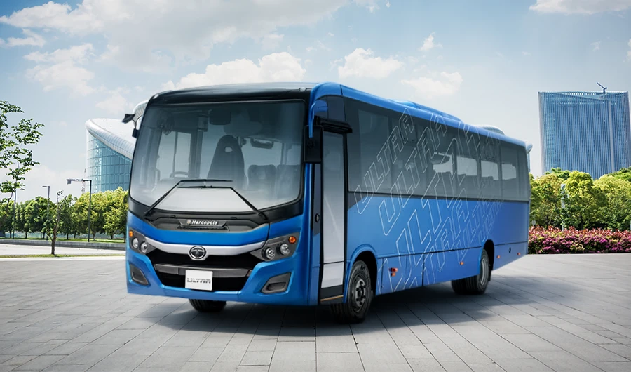 Blue Tata Starbus Ultra LPO 7.5/44 bus parked outside a modern commercial building