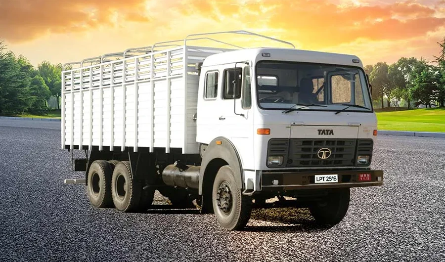 hite Tata LPT 2516 rigid cargo truck set against a sunset sky background