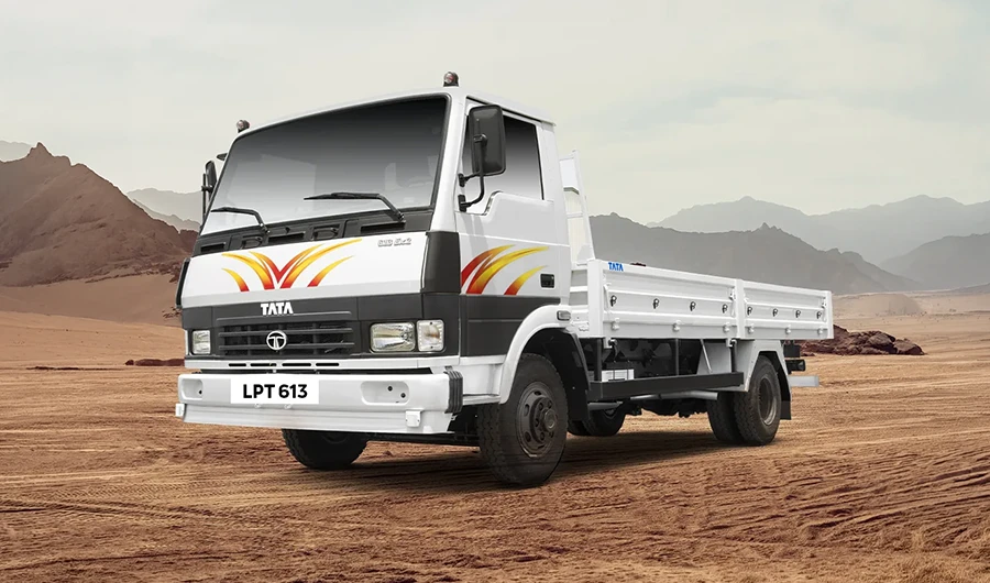 Front head-on view of a white Tata LPT 613 commercial truck on an open road