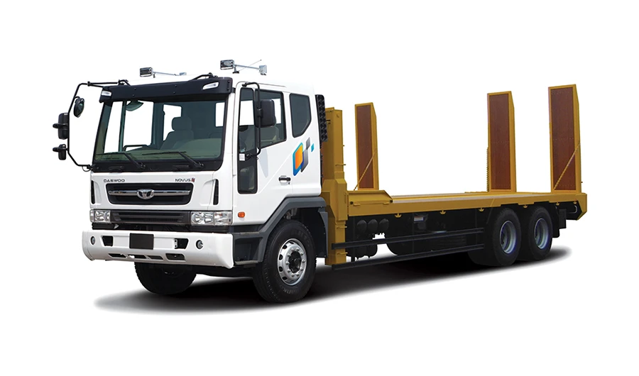 White Daewoo Novus lowbed self-loader truck with raised yellow hydraulic ramps