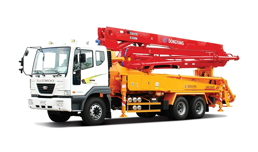 White Daewoo Novus truck equipped with a red Dongyang concrete boom pump assembly"