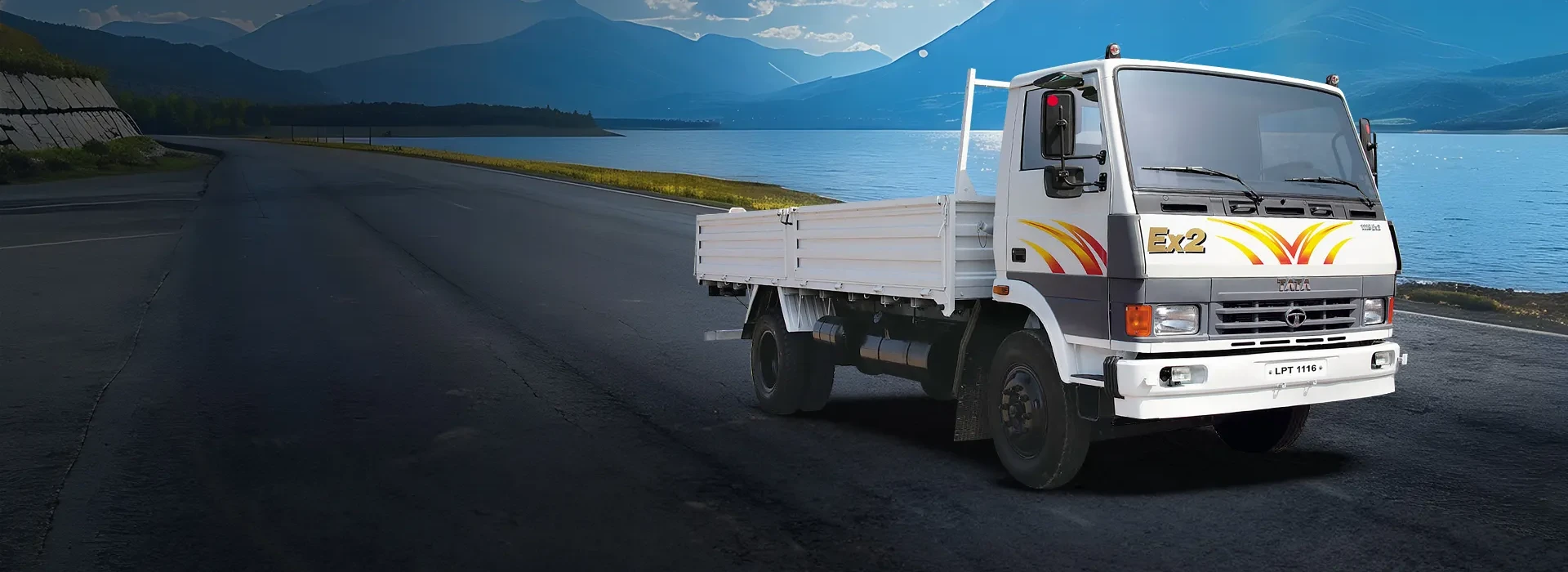 Tata LPT 1116 EX2 drop-side truck banner image parked near lake and mountains