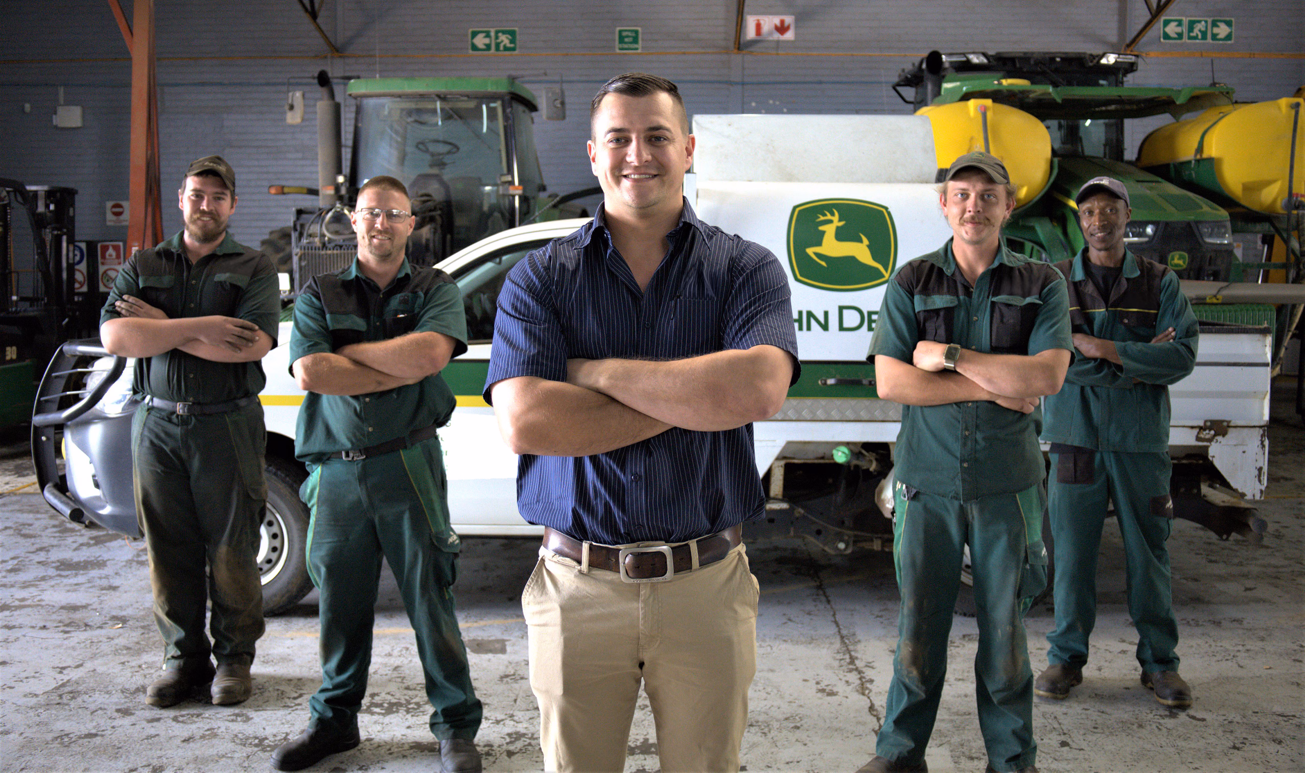 John Deere service technicians and agricultural equipment maintenance team
